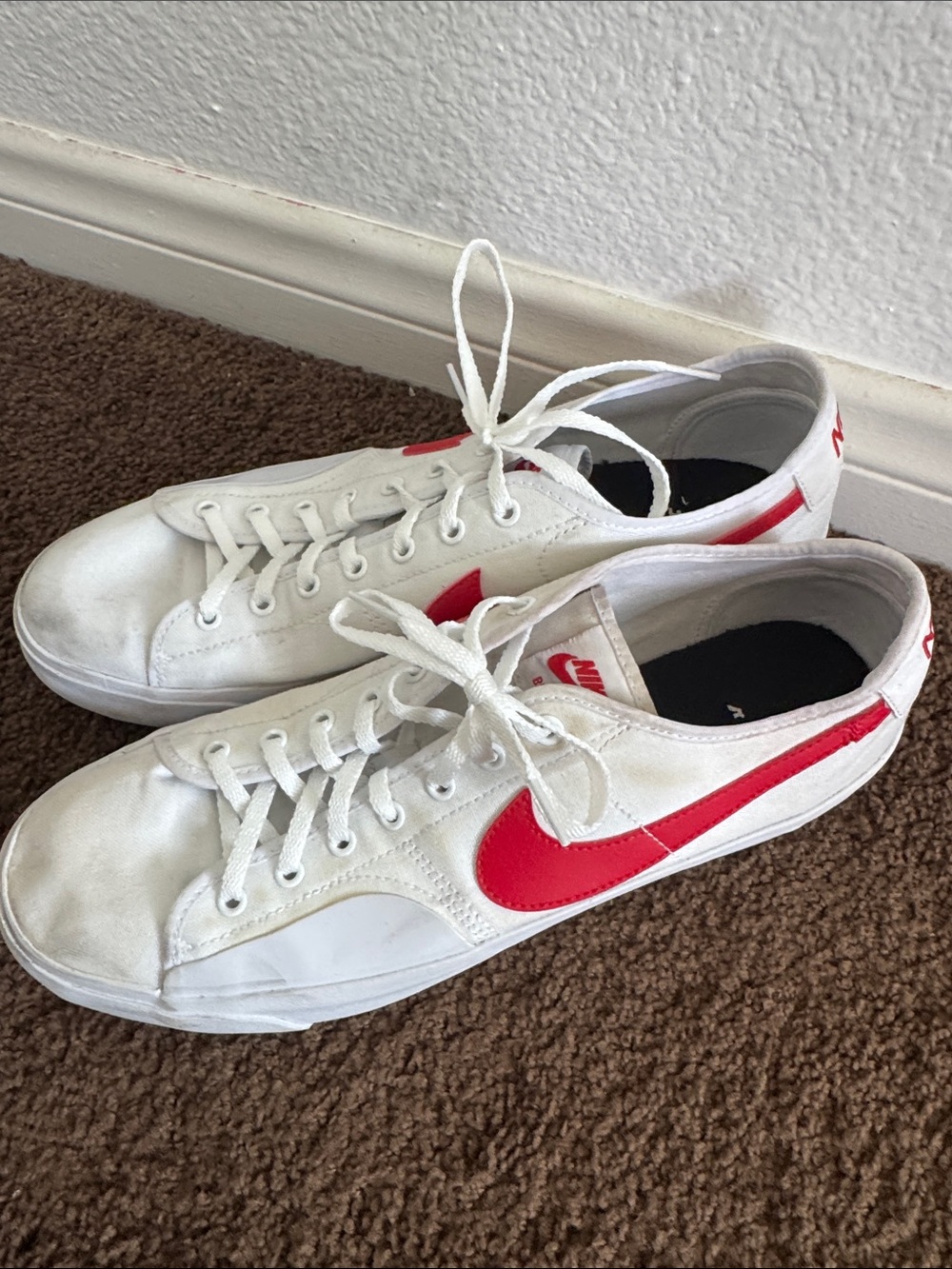 Nike Women’s White Canvas Low-Top Sneakers with Red Swoosh